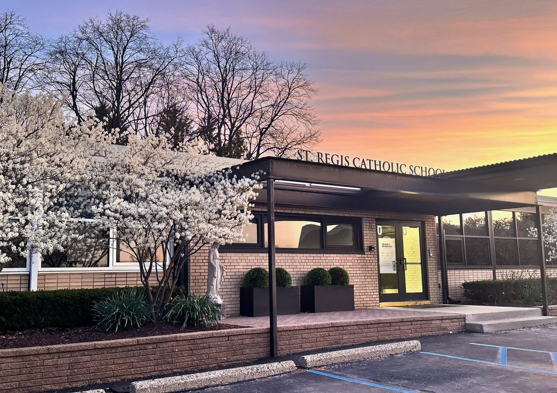 St. Regis Catholic School building at sunset