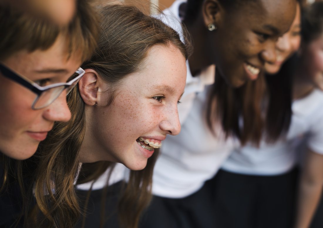 Smiling students in school uniforms