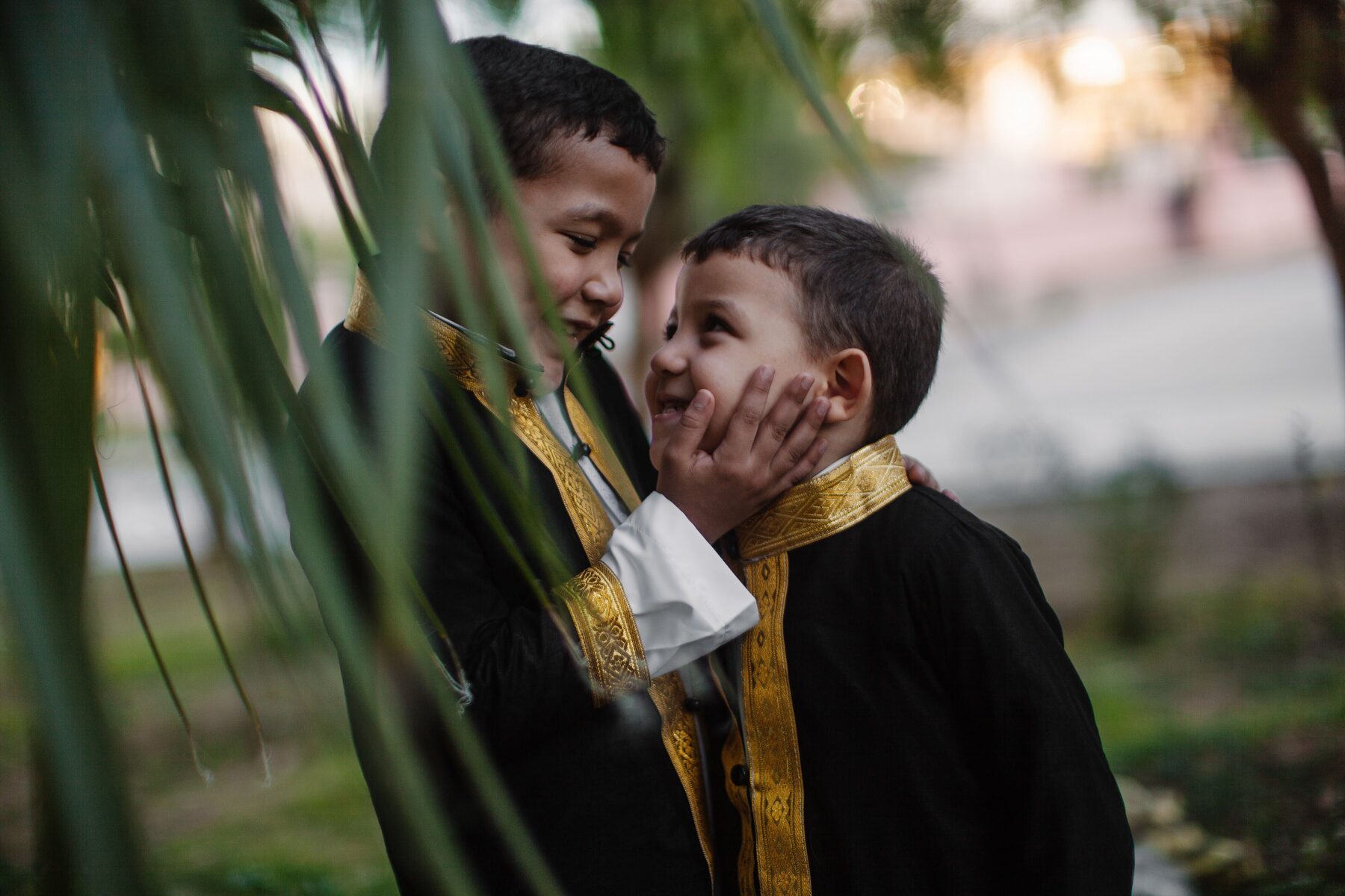 Two smiling boys in robes